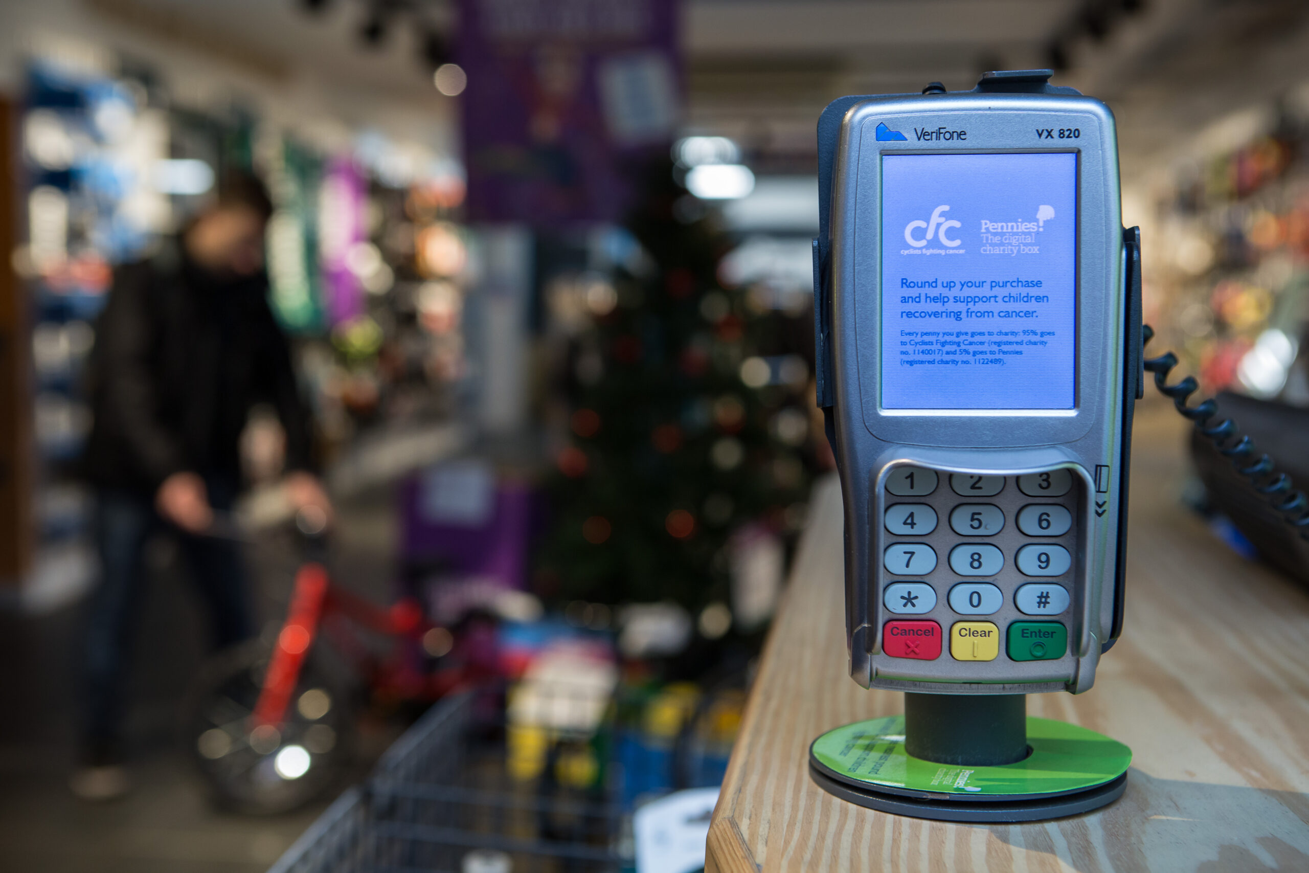 Pennies messaging at the point of sale on Verifone terminal in Evans Cycles, 2016