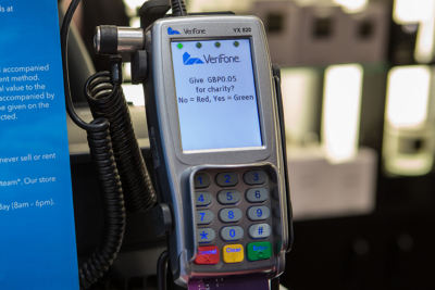 An image of a Verifone payment terminal, with Pennies' option to donate on display